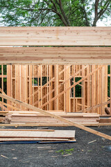 Wall Mural - Closeup detail of new house construction, wall wood framing started and glue laminate header beam installed, structural support
