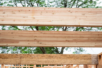 Wall Mural - Closeup detail of new house construction, wall wood framing started and glue laminate header beam installed, structural support
