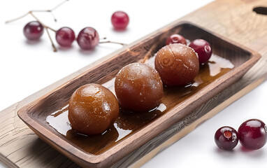 Wall Mural - Plate of tasty Gulab Jamun with on white background.