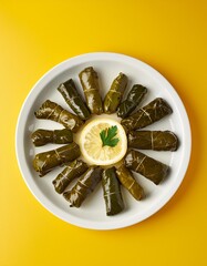 Wall Mural - Turkish stuffed dish dolma on yellow background