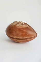 a football american ball, side view, white background.generative ai