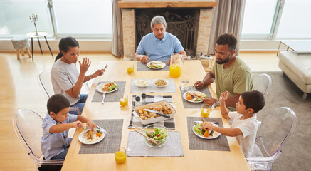 Canvas Print - Happy family, lunch and eating food at table together for holiday celebration, bonding and sharing a meal. People, parents and grandfather with kids in home for dinner, social gathering and top view