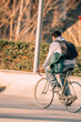 © carballo - young man on the street riding on vintage bicycle