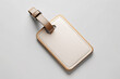 © Adisorn - Empty luggage tag mockup with unique shape and high-quality material, perfect for showcasing travel accessory designs in a stylish and modern way.