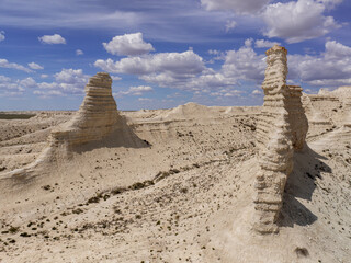 Eye-catching view of Akkergehsen plateau: whimsical weathered snow-white rocks. Kazakhstan.