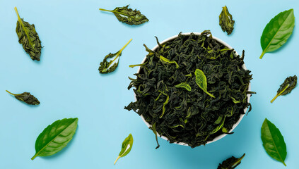 Green tea leaves background light blue