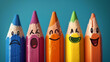 © Karen - Row of colored pencils with various emotions faces drawn on their tips, depicting different expressions on a blue background.