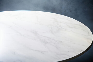 Wall Mural - Empty round white marble tabletop on dark blue background for product placement