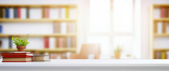 Aufkleber - Books and green plant on white desk with blurred bookshelves background