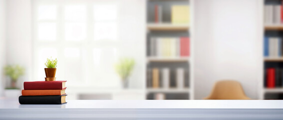 Poster - Stack of books and a small plant on a white table in a home office with blurred bookshelf background