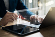 © Thapana_Studio - Cyber ​​network security and data protection on the internet, businessman using security encryption of laptop and tablet with padlock icon, protecting sensitive business and financial information.