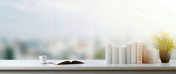 Poster - Empty white desk books, a coffee cup and a plant with blurred city view background