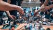 © Noon - A team of researchers discussing and assembling a drone in a research facility, with various drone parts and equipment visible