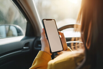 Closeup driver hand is holding smartphone with white screen