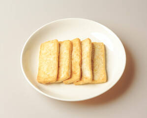 Canvas Print - Close-up of five pieces of Tofu Jeon(Pancake) on white dish, South Korea
