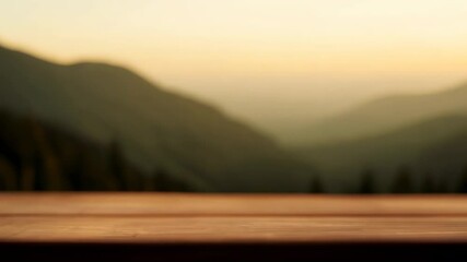 Wall Mural - Empty wooden table overlooking serene mountain landscape at dusk