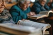 © Anat art - A group of elderly individuals focuses on learning foreign languages using textbooks and dictionaries in a cozy classroom setting. Generative AI