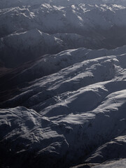 Wall Mural - Aerial view of snowy mountain range in New Zealand.