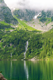 Morskie Oko, or Eye of the Sea. Beautiful mountain lake. View of the Dwoista Siklawa waterfall. Summer landscape in the Tatras