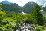 Morskie Oko, or Eye of the Sea. View of the Czarnostawianska Siklawa waterfall. Summer landscape in the Tatras