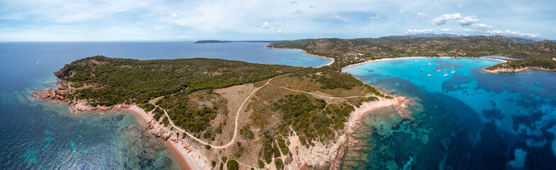 Wall Mural - Panoramic aerial view of yachts moored in the turquoise Mediterranean sea at the bay of Rondinara on the island of Corsica