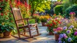 © Caitlin - Vibrant blooming flowers surround a worn, wooden rocking chair with a vacant, yet inviting, space on a serene outdoor patio scene.
