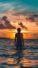 Wall Mural - A serene moment as a figure stands in still waters during a vibrant sunset