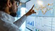 © buraratn - Businessperson pointing at a financial chart on a whiteboard, explaining investment trends and market analysis.
