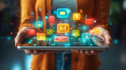 person holding tablet with vibrant app icons