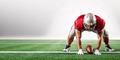 Intense Football Player Ready for Action. A determined football player crouches on the field, preparing for the play in a dynamic stadium setting.