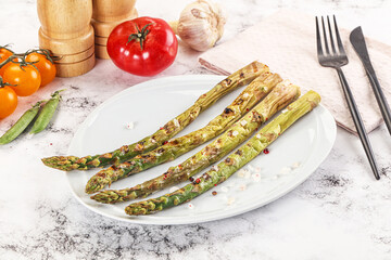 Canvas Print - Grilled asparagus sprouts served red pepper