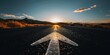 © blinkstud.io - A straight road with an arrow painted on it leading to the distant horizon, symbolizing goal setting and achievement in business