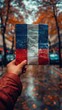 © zakir - French voter with a ballot paper in hand and French flag