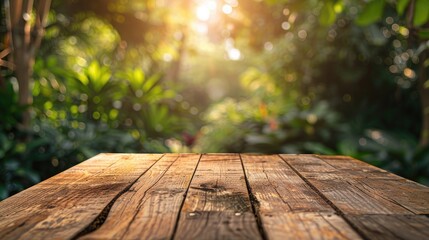Poster - Wooden table placed against garden light blur background for product showcasing mock up