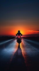 Wall Mural - A lone rider glides on the open road as the sun sets beautifully