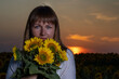 © Олег Мальшаков - Beautiful young girl in a white dress in sunflowers