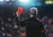 © Bargais - A soccer referee showing a red card in a match.