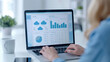 © Lila DK - A business professional analyzing cloud data on a laptop screen displaying charts, graphs, and cloud icons, representing data analytics, cloud computing, and business intelligence in a modern office.