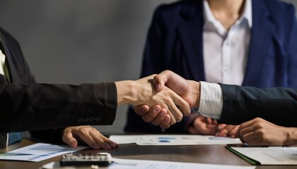 two people shaking hands negotiating