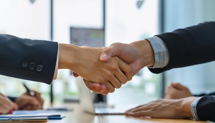 two people shaking hands negotiating