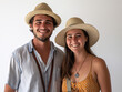© chaiwat - Sun-Kissed Smiles and Straw Hats: A portrait of a happy young couple, their radiant smiles mirroring the warmth of the sun, ready for adventure.