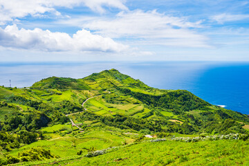 Wall Mural - View of ocean and green cliffs on ocean coast of Flores island, Azores, Portugal