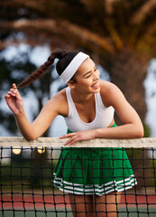 Canvas Print - Tennis, relax and woman at net with smile, pride and outdoor workout for practice match. Fitness, game and happy athlete girl on court for fun competition, sportswear and professional at sports club