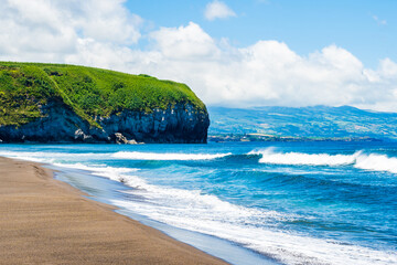 Waves on ocean at Saota Barbara beach with black sand near Ribeira Grande town, Sao Miguel island, Azores, Portugal