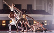 © CineLens2024/peopleimages.com - Ballet, theatre and group of people on stage together for performance, showcase or talent. Art, creative and dance with performing arts students in classic venue for classic dancing or elegance