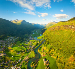 Wall Mural - Stryn, Norway. Nature in fjords. Traveling through the Norwegian fjords. River in a mountain valley. Scandinavia. View of nature from the drone. Vacation and travel in summer Norway.