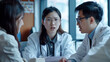 © Vilma - Medical Team Discussion, Asian Doctors Collaborating in a Clinical Setting, Suprised Worried Doctor Woman, Hospital Clinic Workspace
