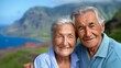 © Nataliia_Trushchenko - A couple of older people are smiling at the camera. The man is wearing a blue shirt and the woman is wearing a blue shirt. They are standing on a hill overlooking a body of water