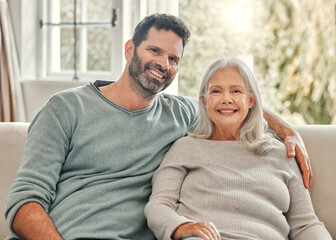 Wall Mural - Senior mother, son and happy in home on sofa in living room for bonding, support and care with visit. People, family and parent with smile on portrait on couch on break to relax, fun and peace