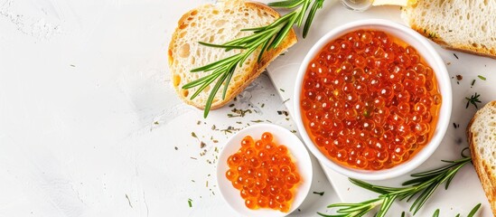 Poster - A bowl of fresh pike caviar with bread rosemary and butter on a white marble table in a flat lay style with room for a copy space image